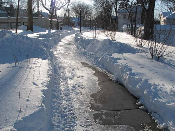 ice on road and sidewalk in winter